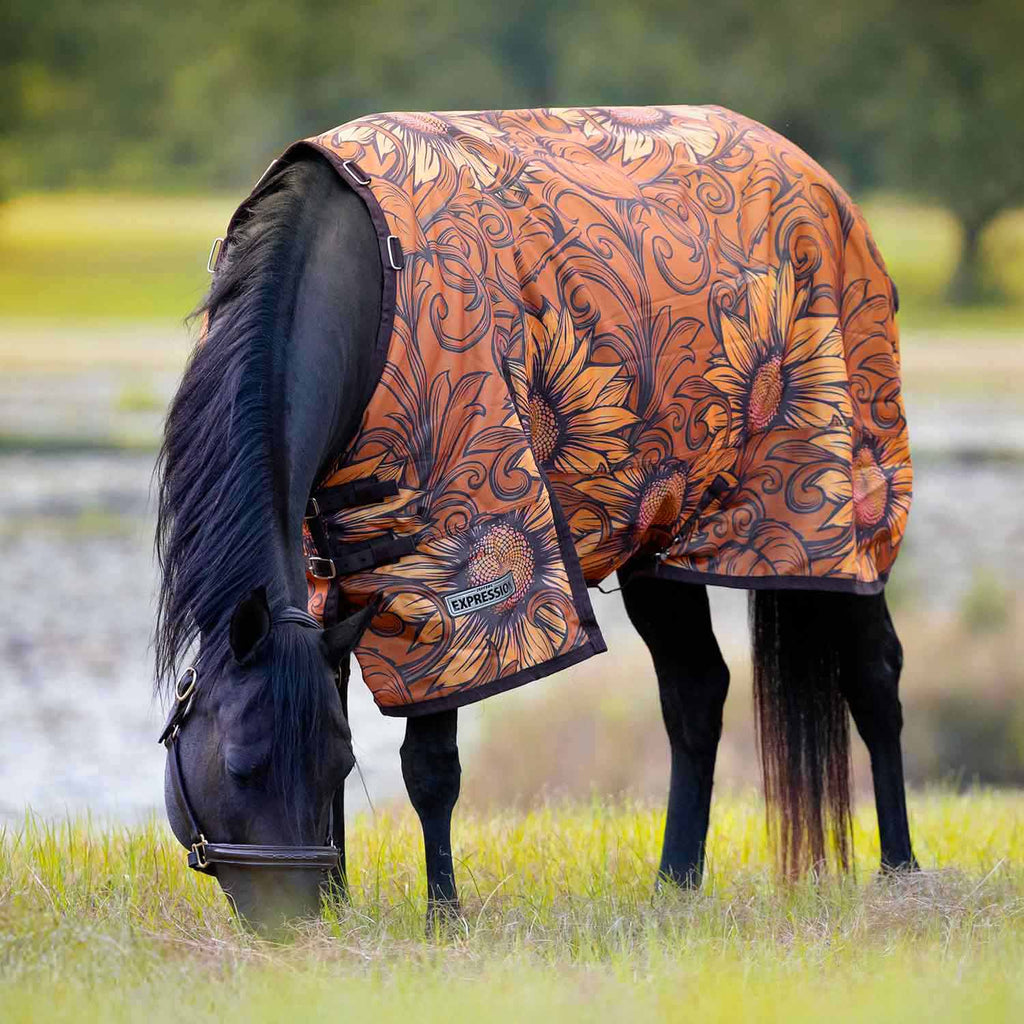 Orange floral patterned turnout horse blanket with standard neck and side view front straps