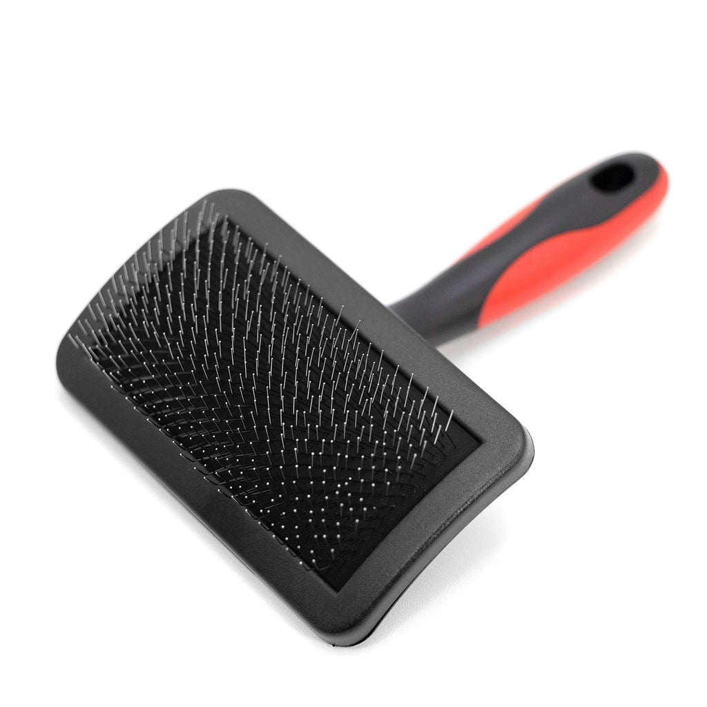 Firm-pin slicker grooming brush with black pin head and red-accent handle