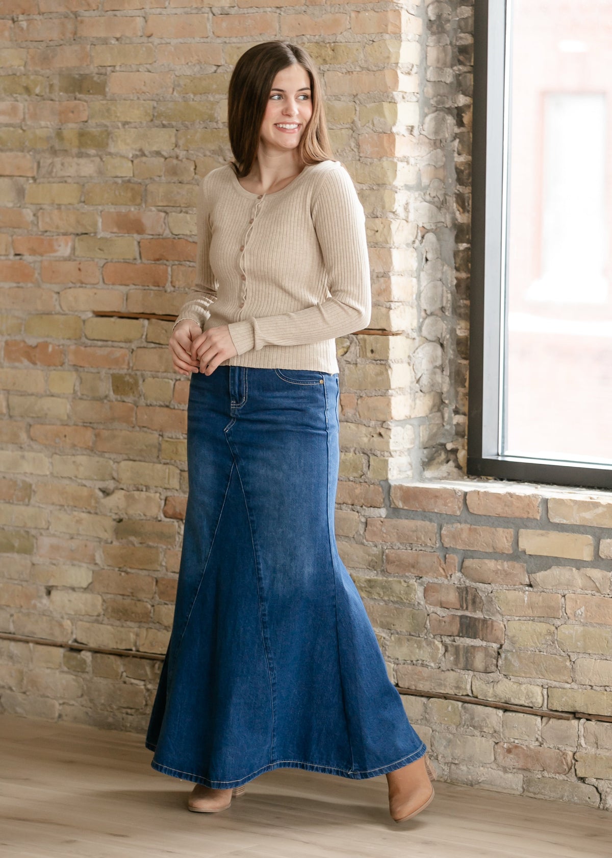 Long denim A-line skirt with front button and belt loops, medium blue wash