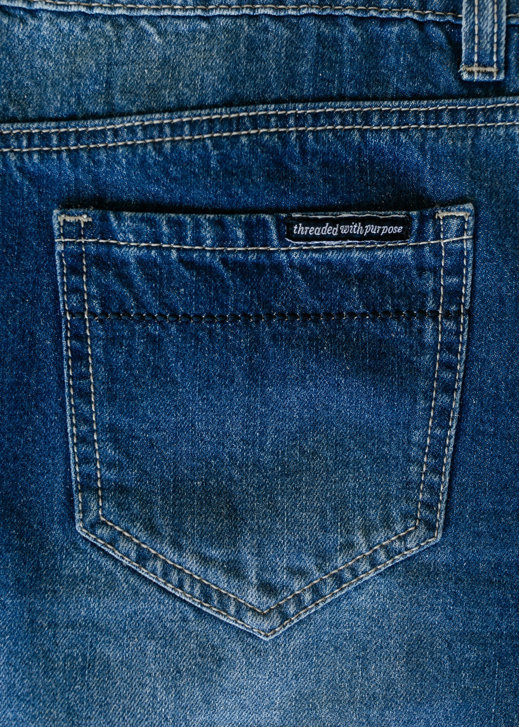 Denim patch pocket with stitched yoke detail on blue long A-line skirt