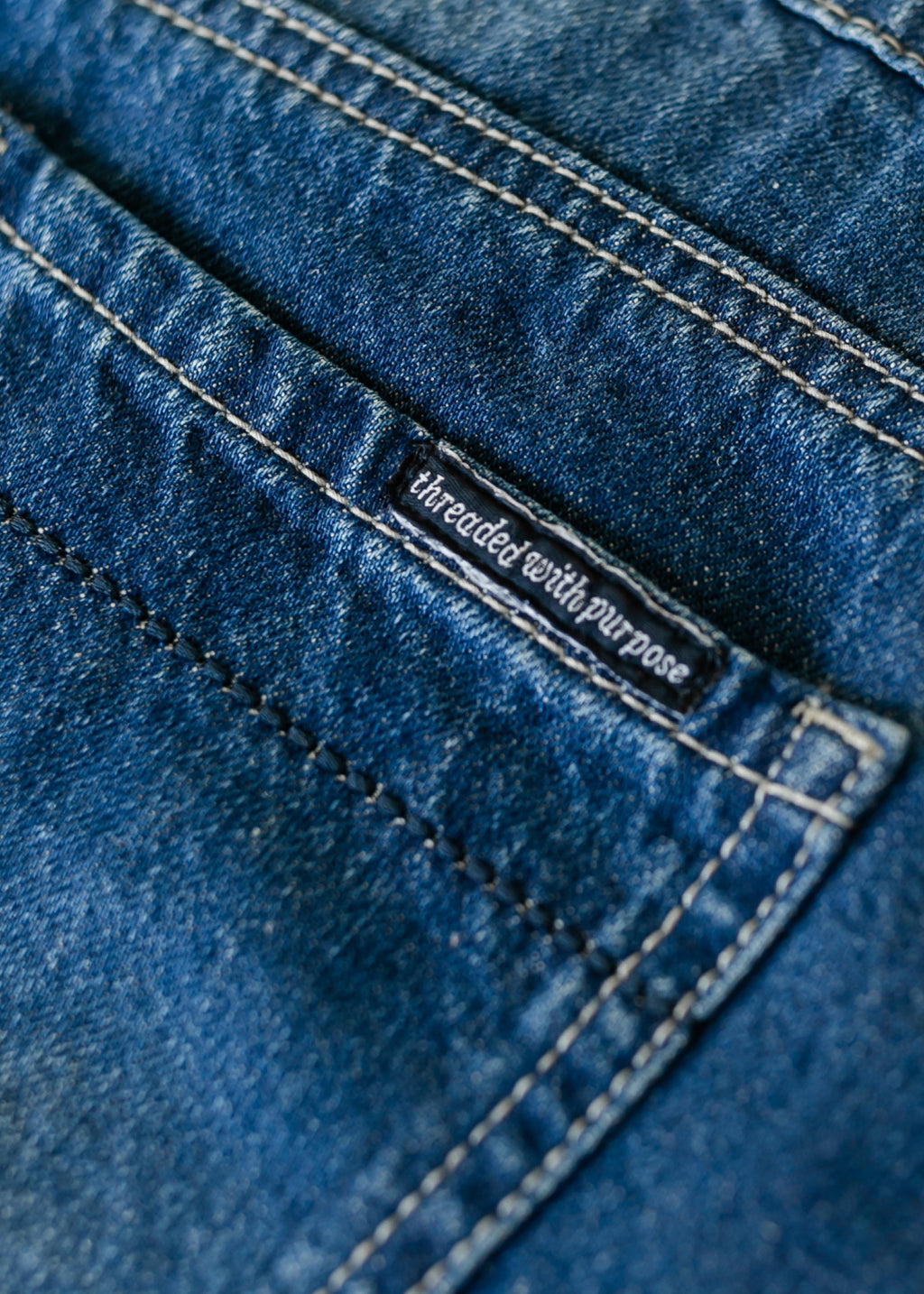 Denim label and double-row stitching on blue A-line skirt