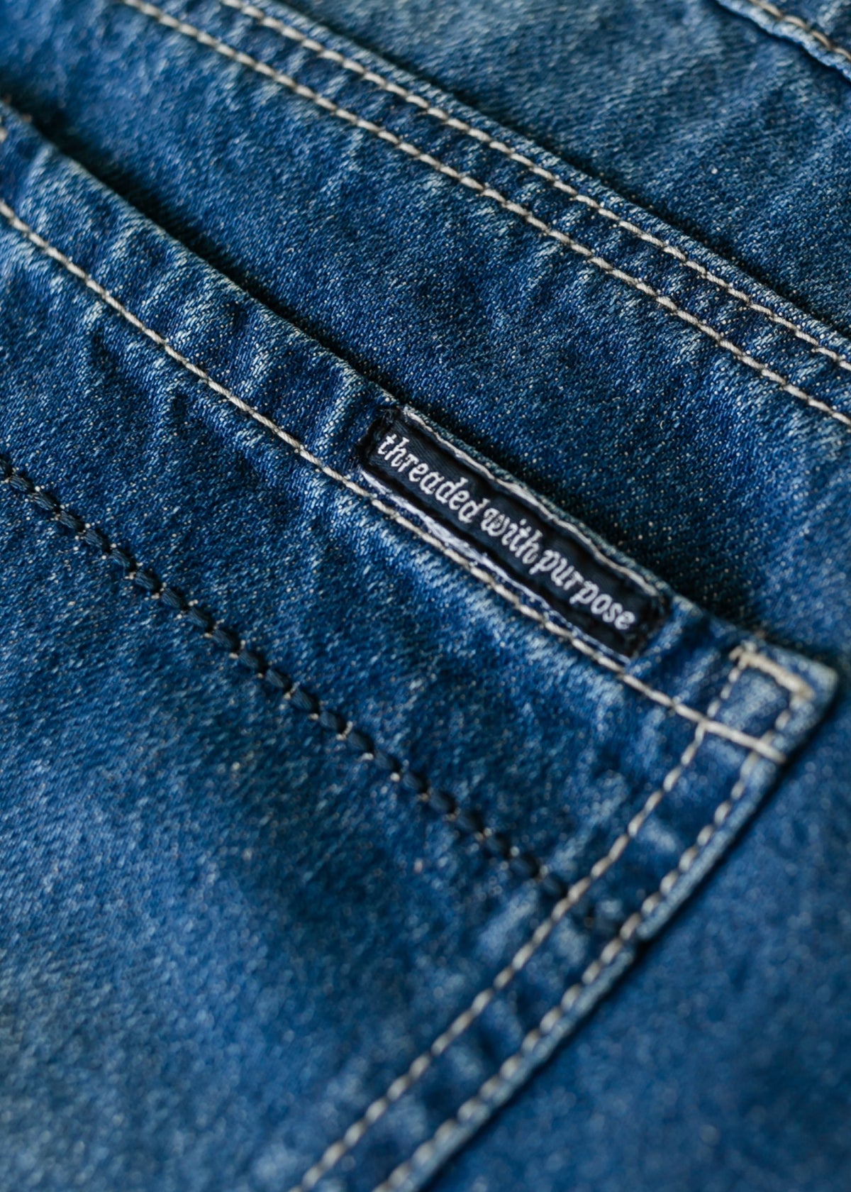 Denim label and double-row stitching on blue A-line skirt