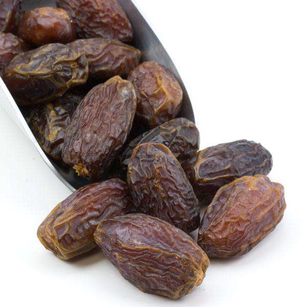 Organic Medjool dates, whole wrinkled dark brown fruit