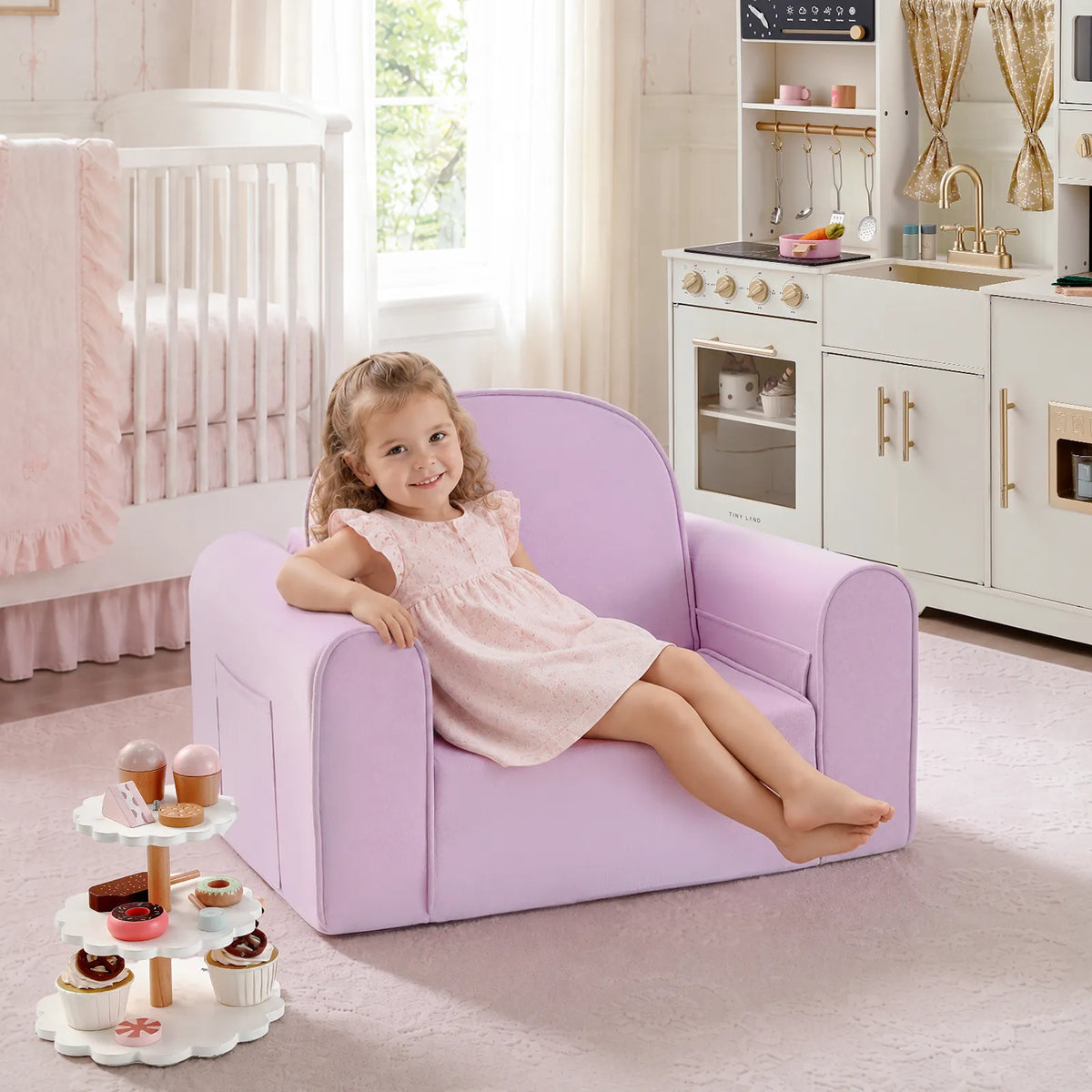 Light purple kids sofa chair with rounded arms, child sitting and feet resting