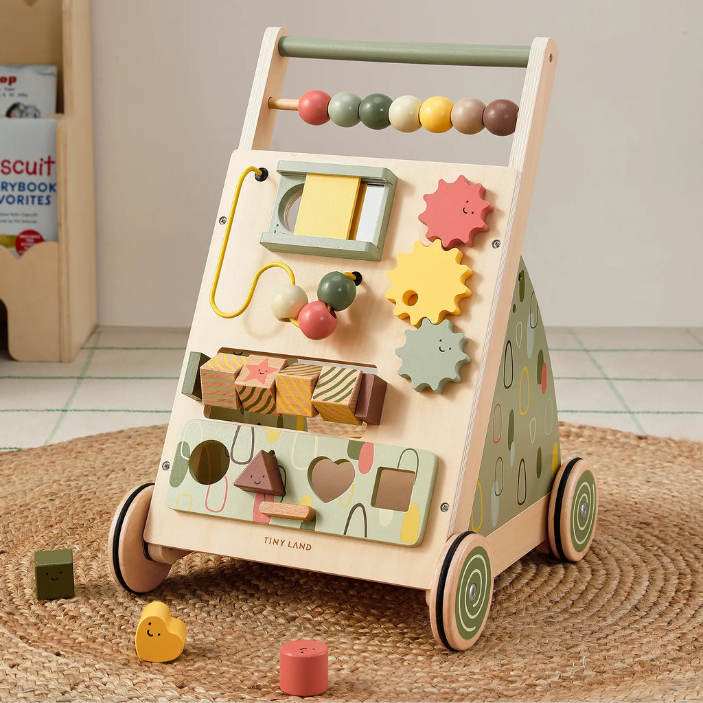 Wooden baby walker in sage green with bead roller, gears, mirror, and activity panel