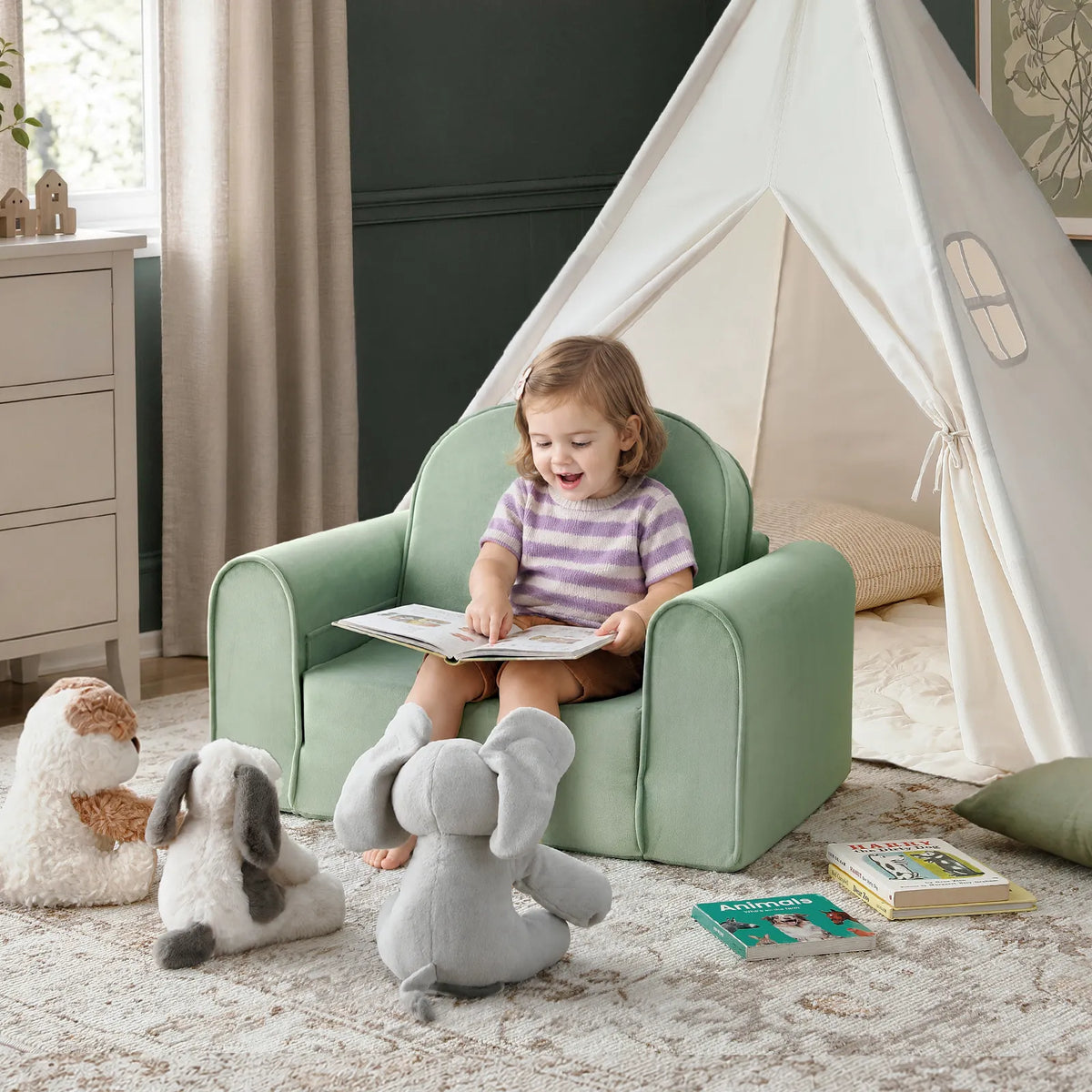 Light green kids sofa chair with low back and rounded armrests for reading