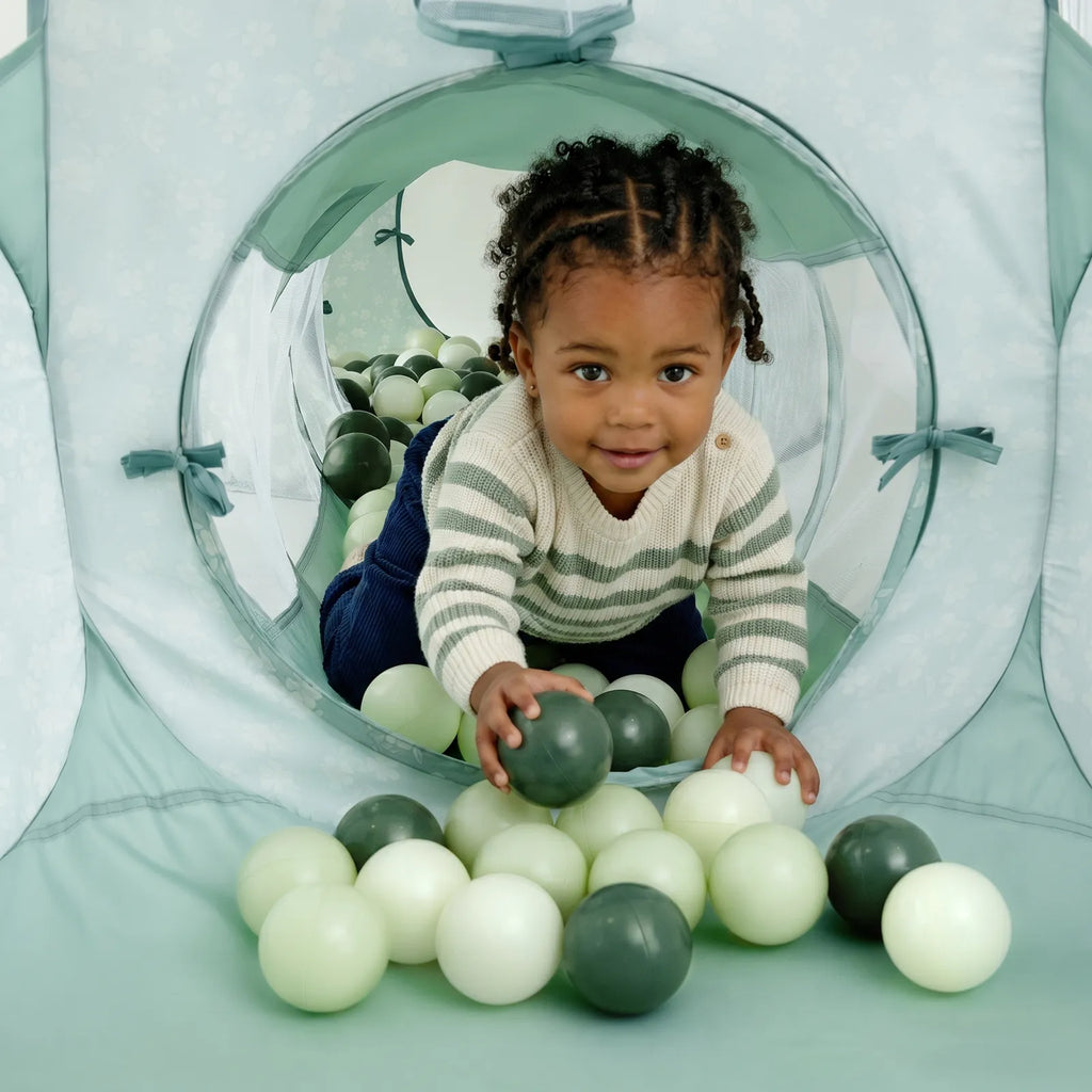 Mint green play tunnel with mesh tunnel opening and padded ball pit