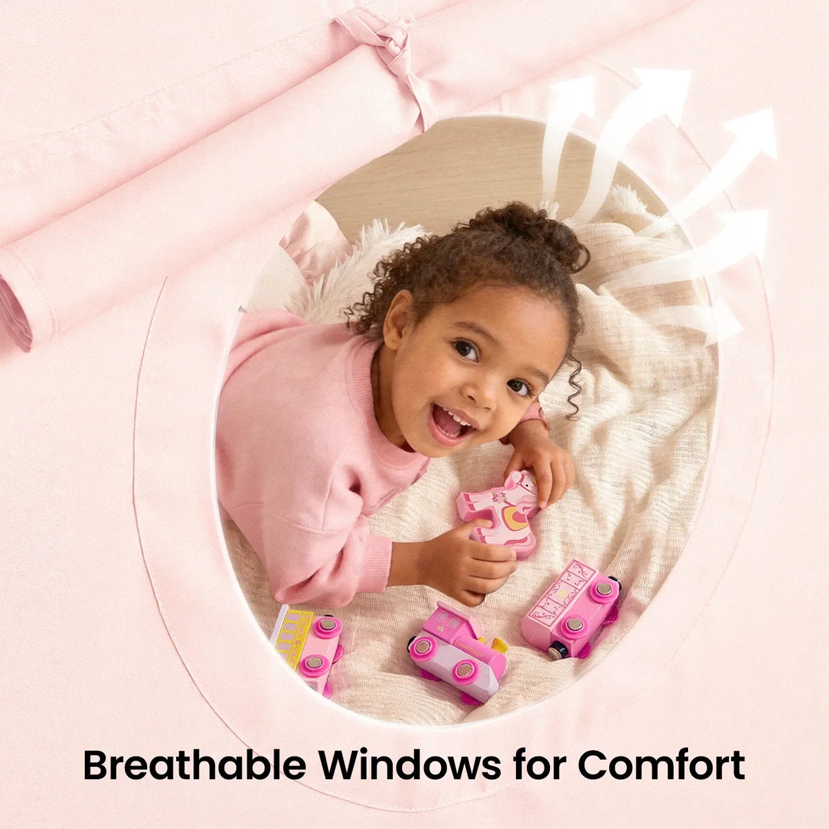 Pink tent fabric with round window and child playing inside