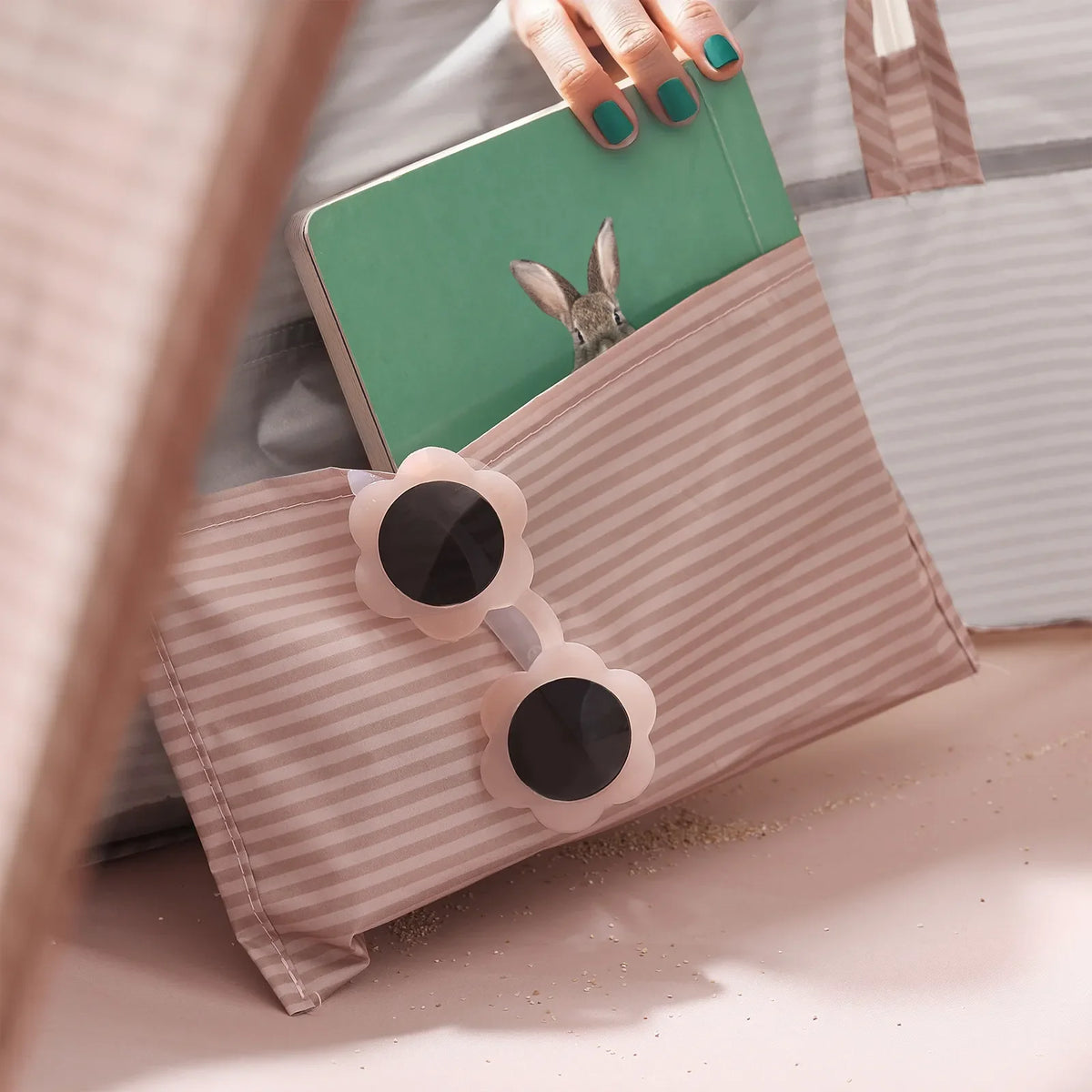 Pink tent side pocket with green toy panel and animal figure