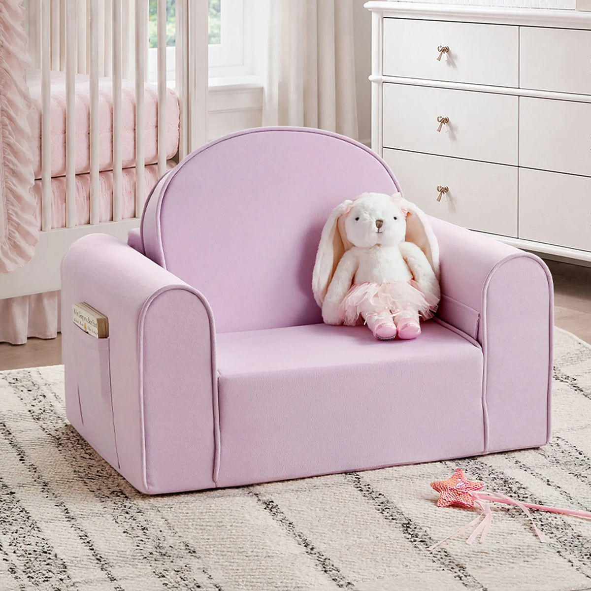 Light purple kids sofa chair with rounded arms and backrest, plush bunny on seat