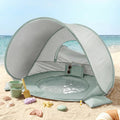 Green striped 3-in-1 baby beach tent with open play window and mesh sides