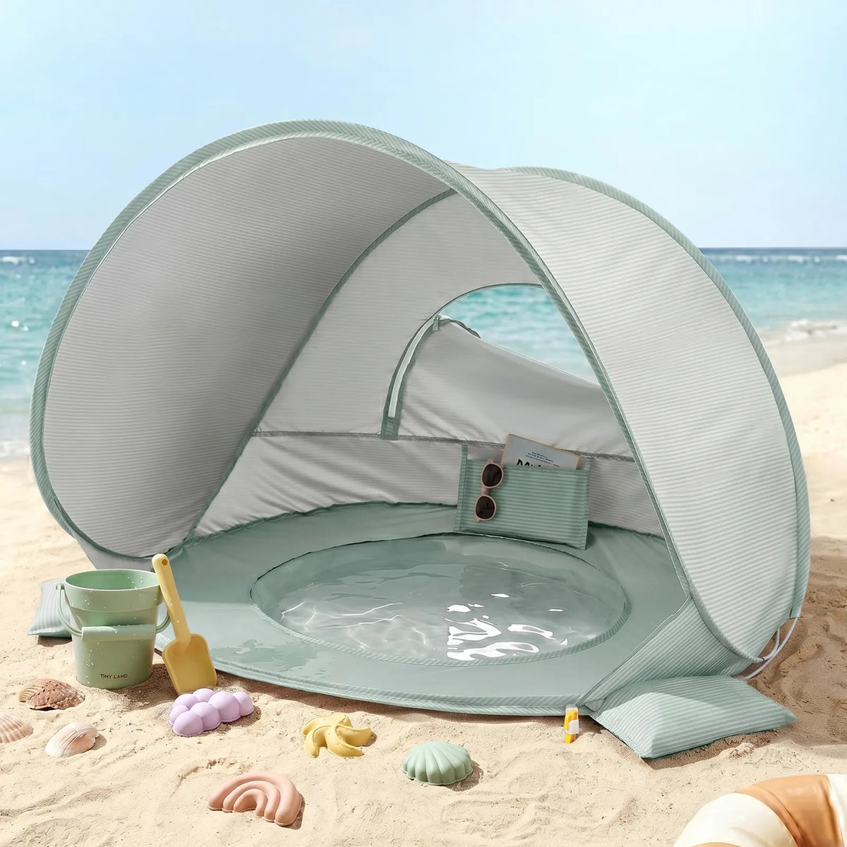 Green striped 3-in-1 baby beach tent with open play window and mesh sides