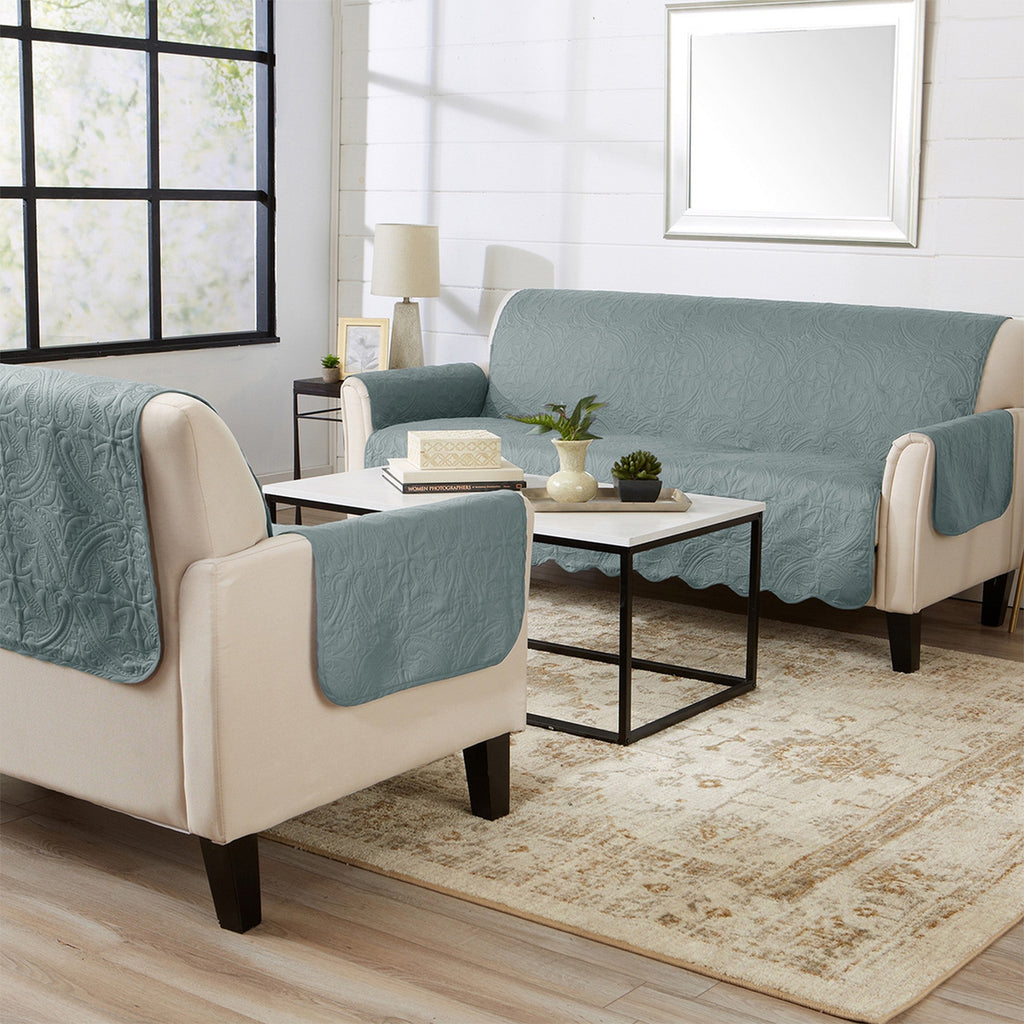Smoke blue loveseat furniture protector over sofa with matching quilted pattern