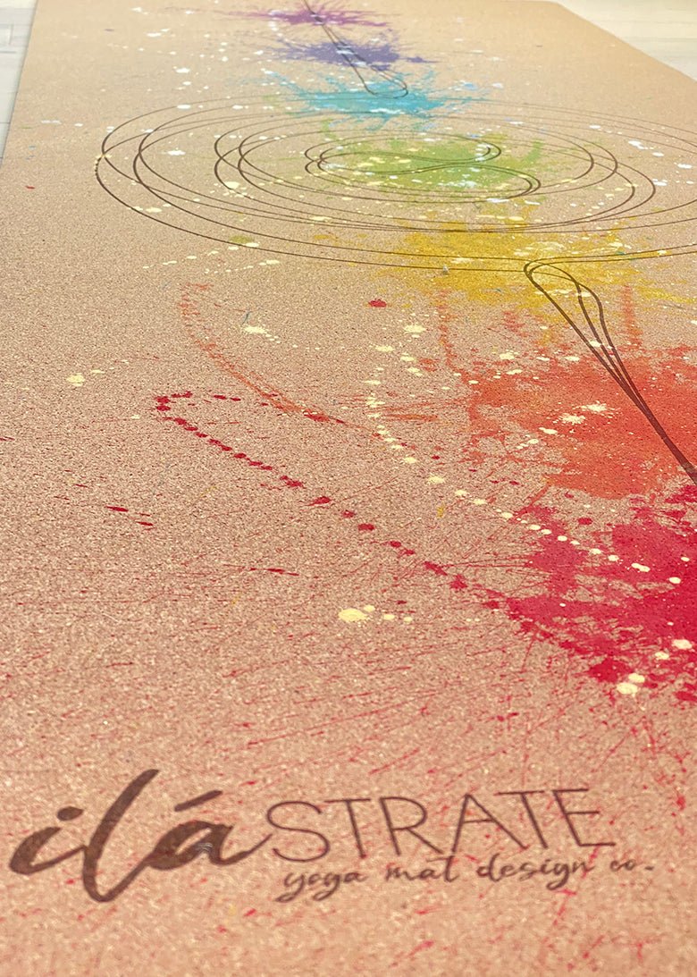 Cork yoga mat with colorful chakra-style print and textured surface