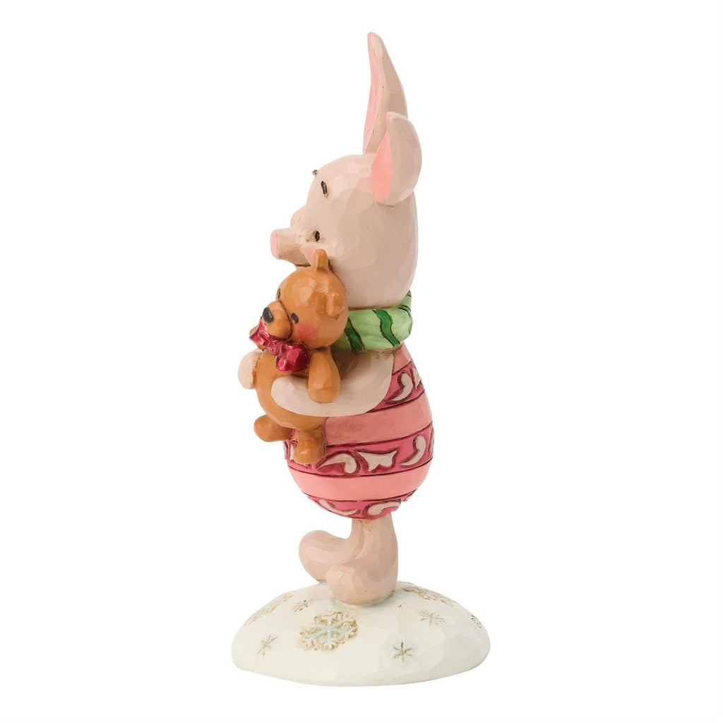 Piglet mini figurine holding teddy bear against chest, green scarf and pink outfit