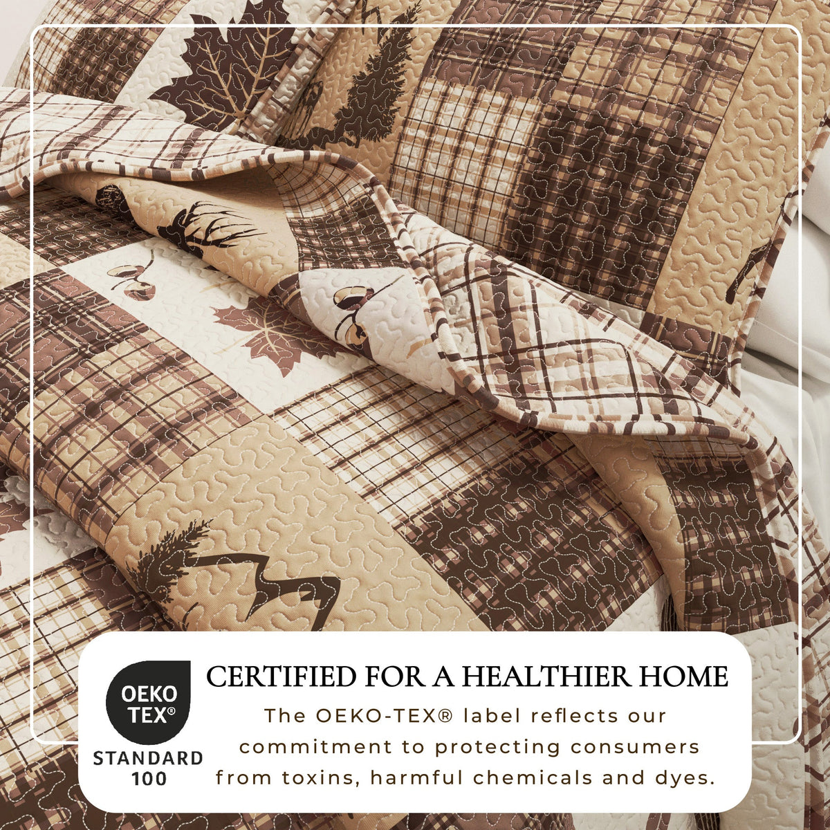 Quilted patchwork bedspread close-up with plaid, deer, and leaf pattern