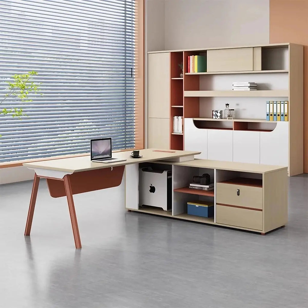 L-shaped desk with light wood work surface, open shelves, and orange drawer front