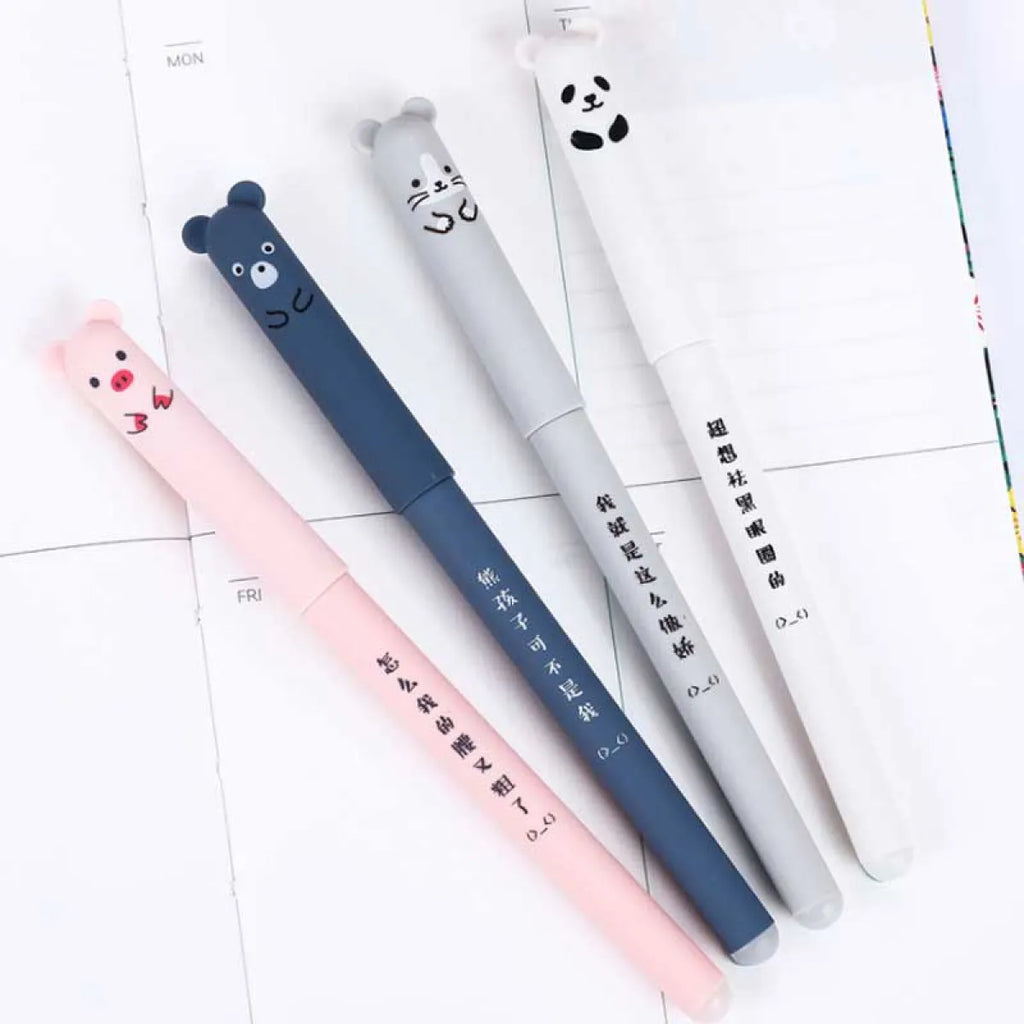 Four animal gel pens in pink, blue, gray, and white on notebook pages