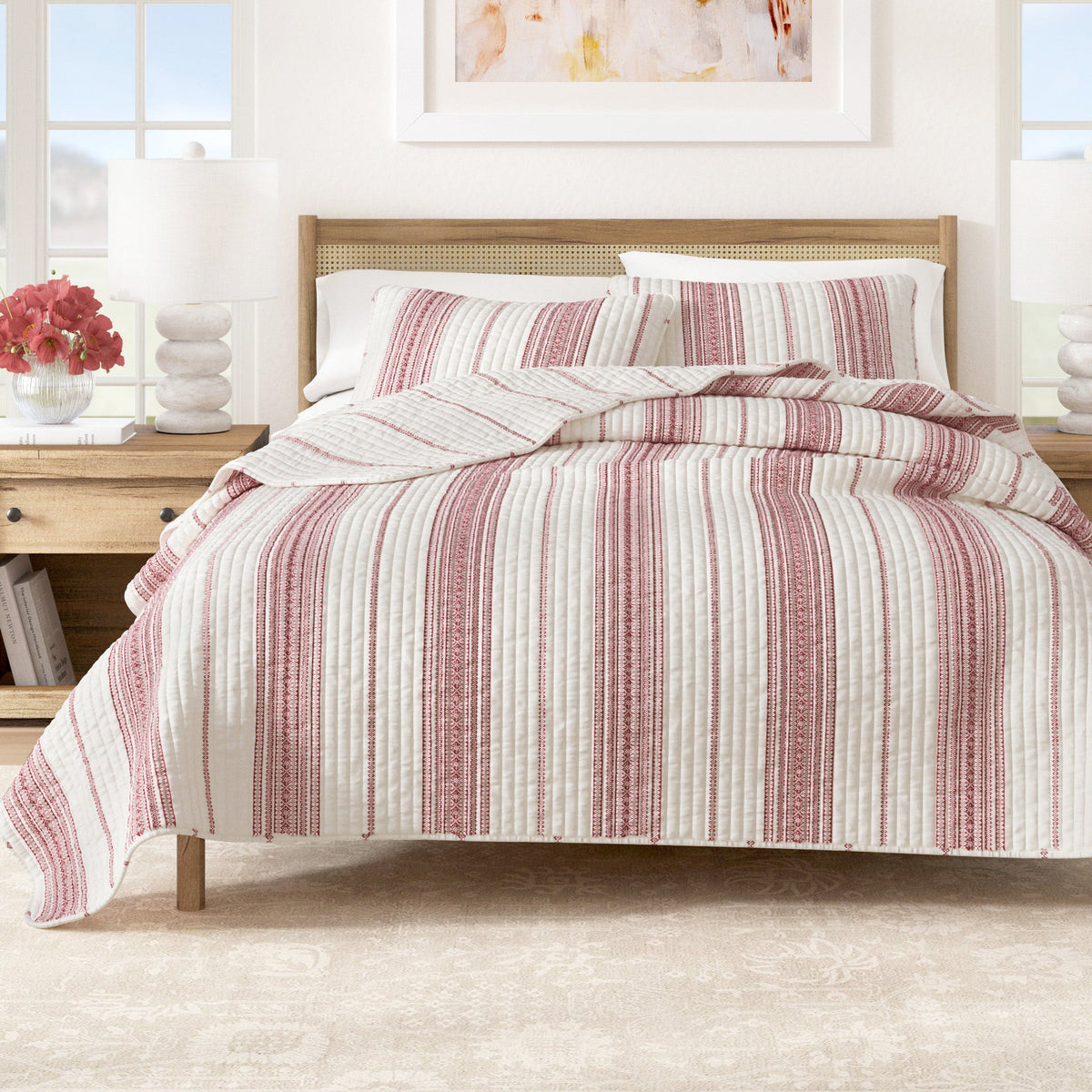 Cream and red striped quilt with channel quilting and striped pillow shams