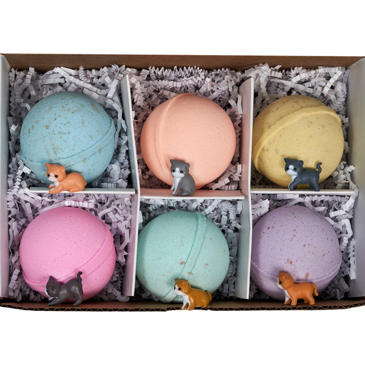 Basket bath bomb gift set with six pastel round bombs and small cat figurines
