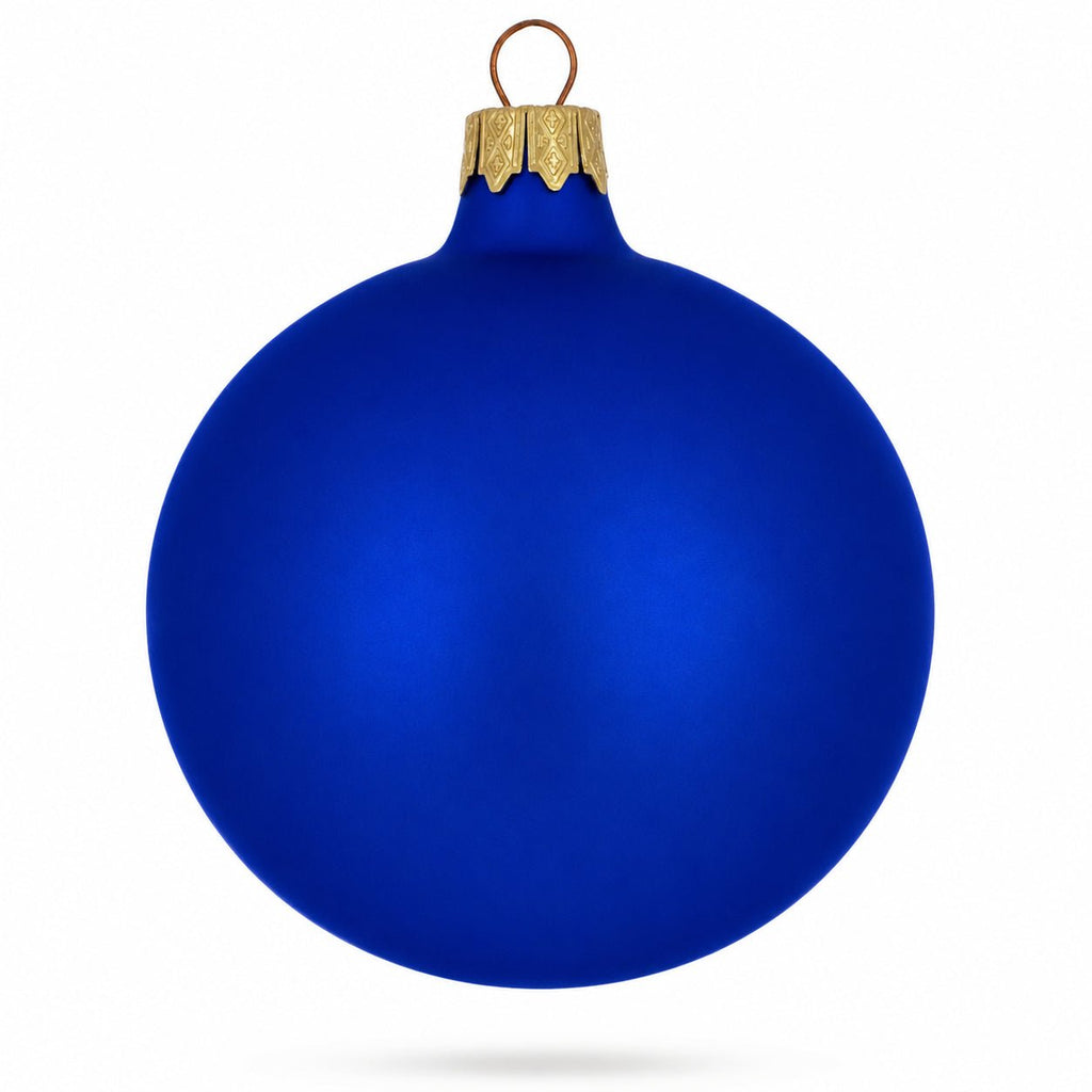 Blue matte glass ball ornament with gold glitter cap and hanging loop