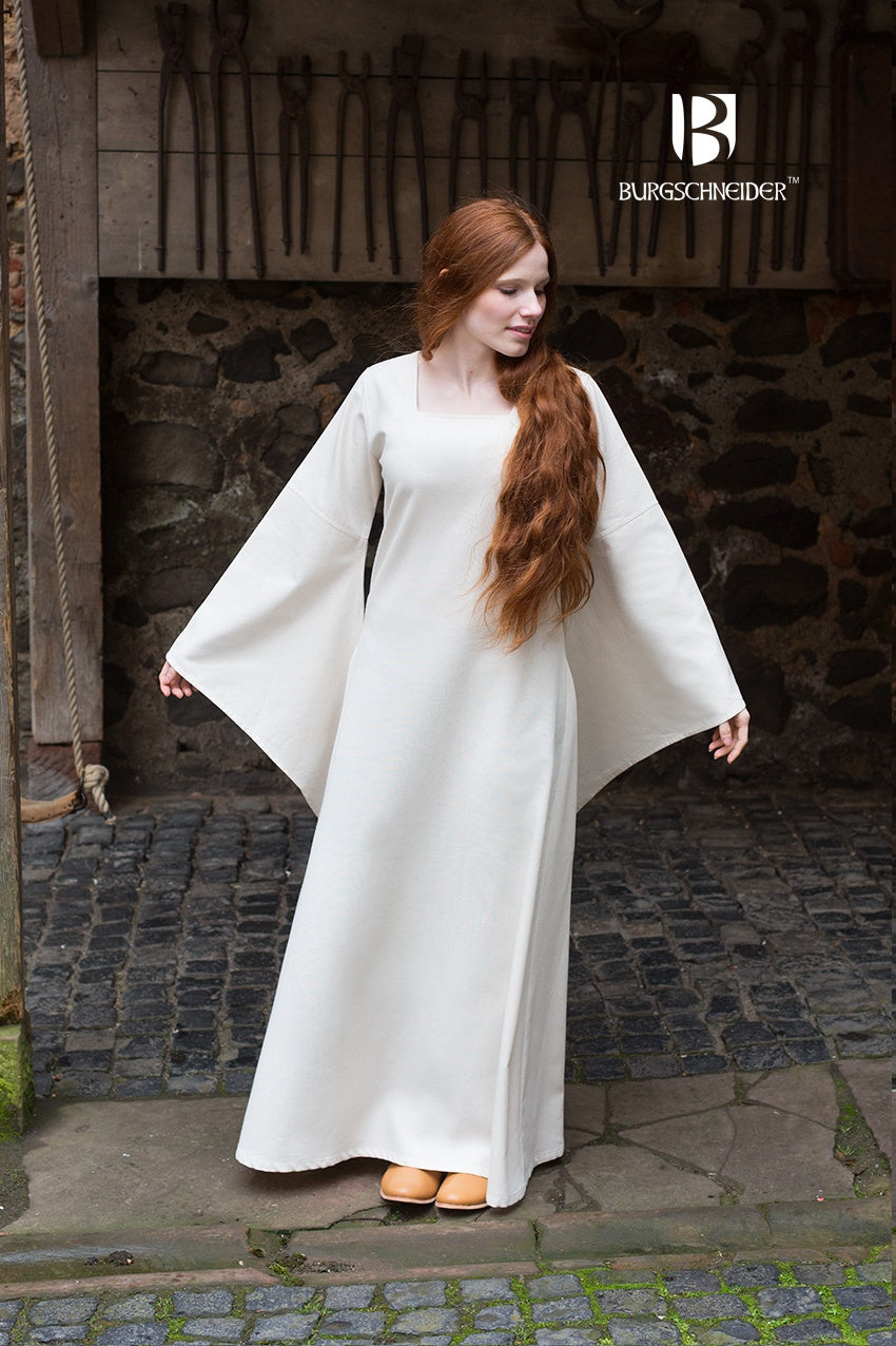 Off-white under dress with trumpet sleeves, square neckline and long skirt.