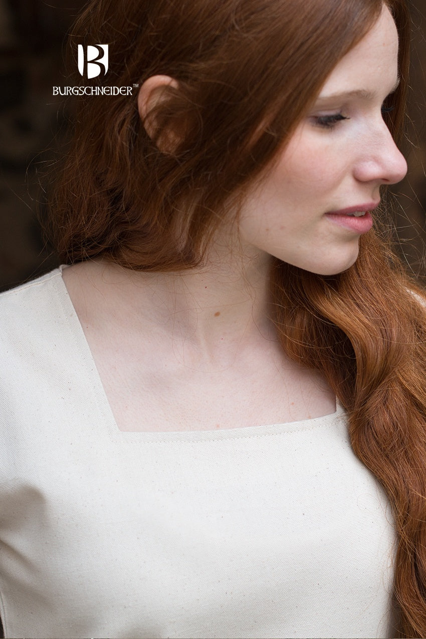 Off-white under dress close-up with square neckline and wide trumpet sleeve.