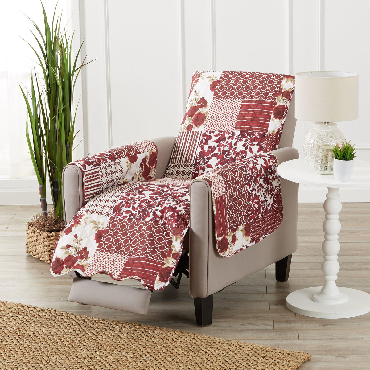Reversible recliner protector set on chair with red patchwork floral and geometric print