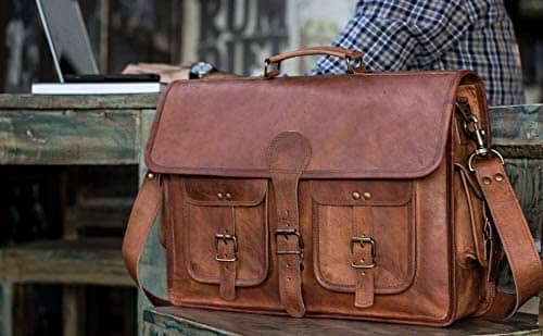 Tan leather briefcase with front flap, multiple buckle pockets, and crossbody strap.