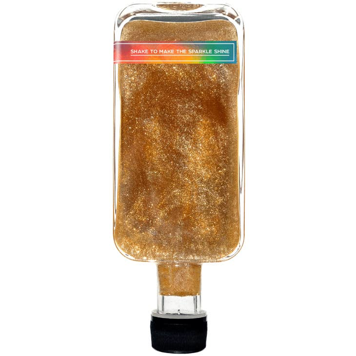 Inverted sparkle maple syrup bottle filled with amber glitter syrup, cap at bottom.