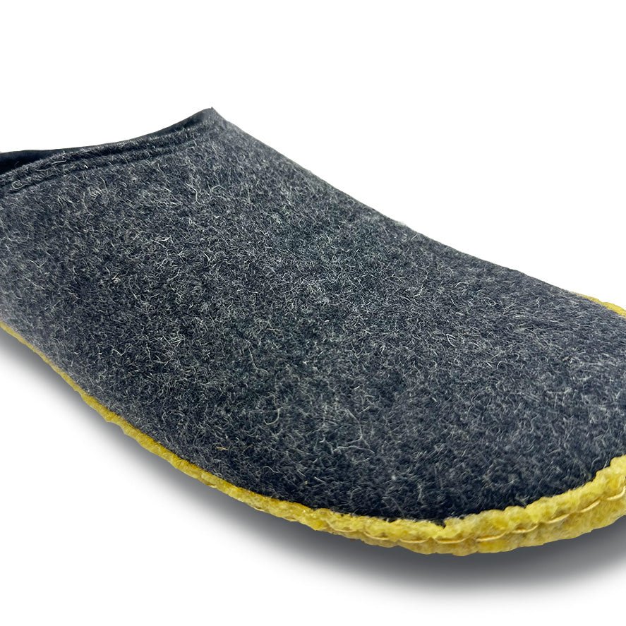 Kyrgies outdoor wool slide sandals in dark gray with yellow rubber edge sole.