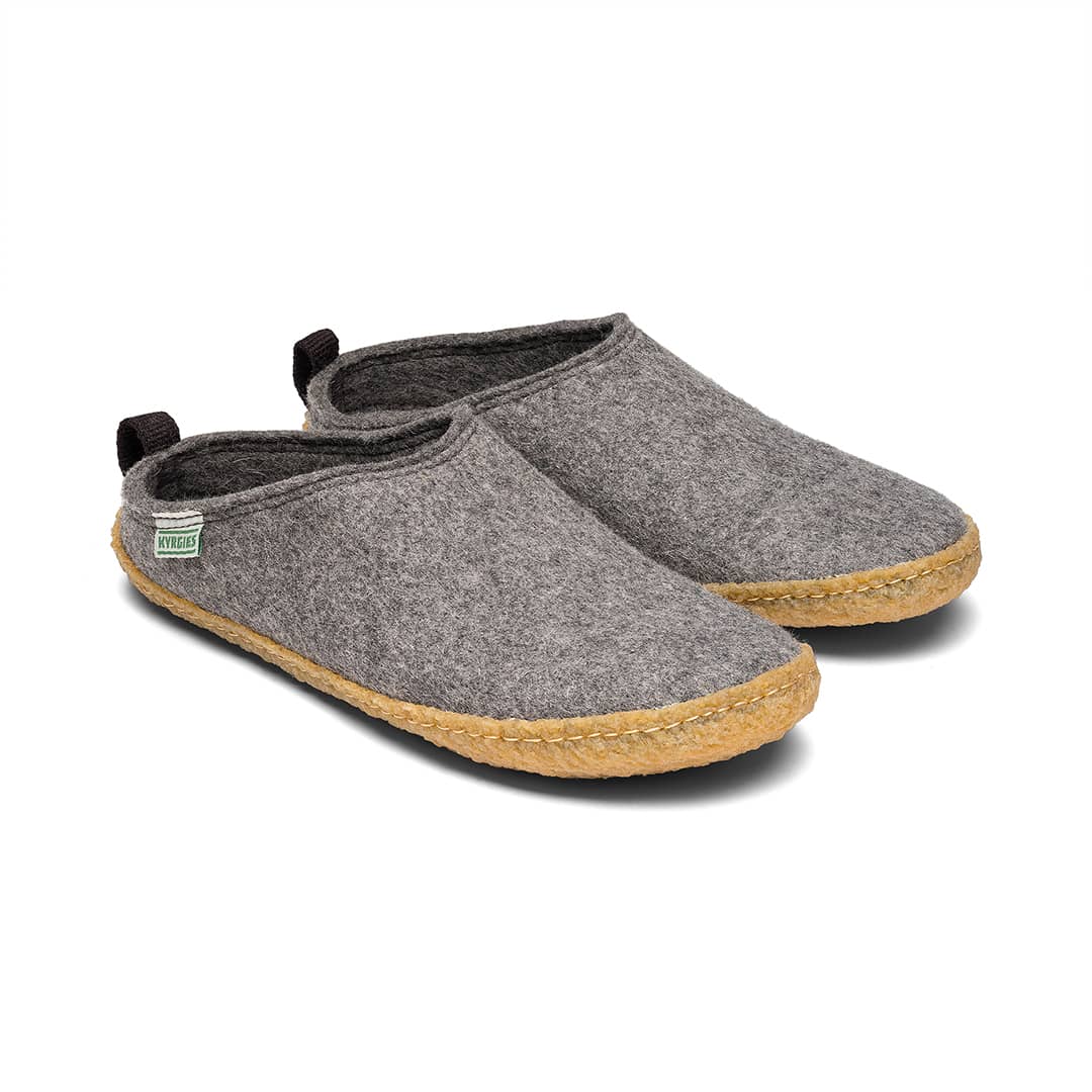 Kyrgies outdoor wool slide sandals in oatmeal/gray with tan rubber sole and heel loop.
