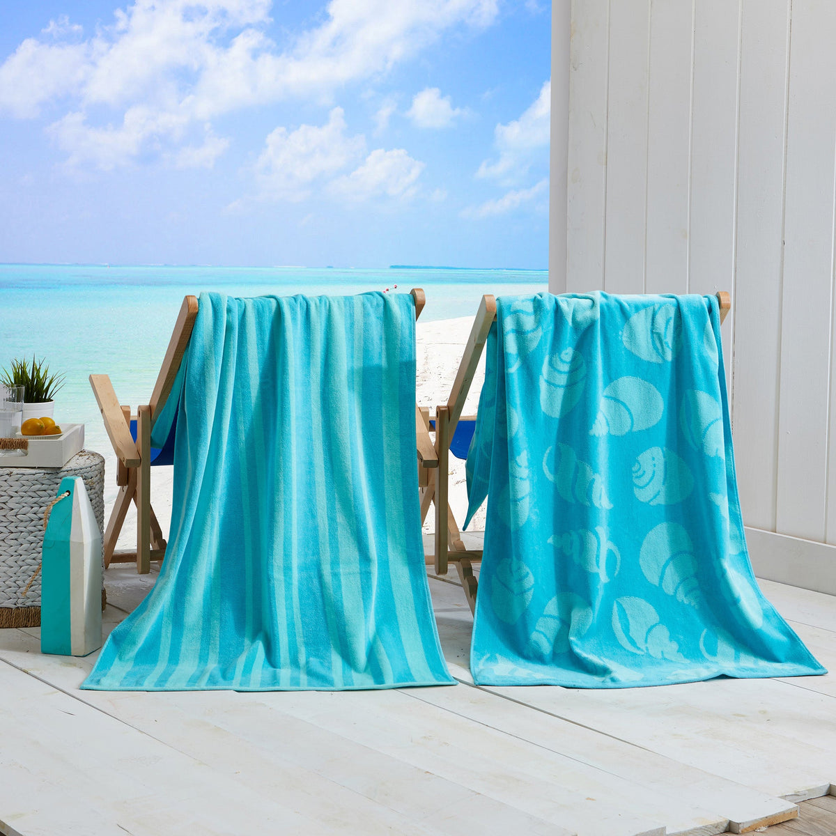 Blue cotton velour beach towels on chairs, textured pile with sea-life print