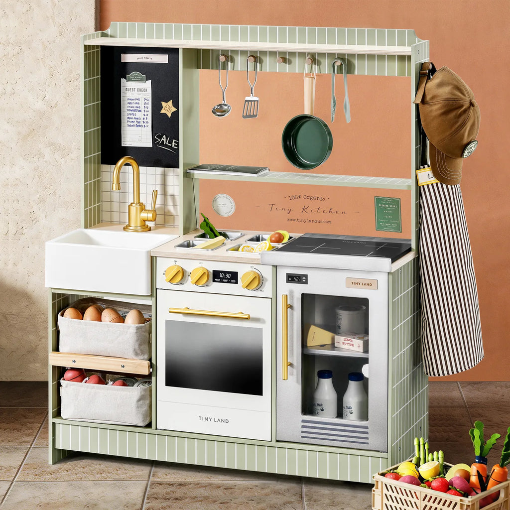 Green kids play kitchen with sink, oven window, stovetop knobs, and hanging utensils rack.