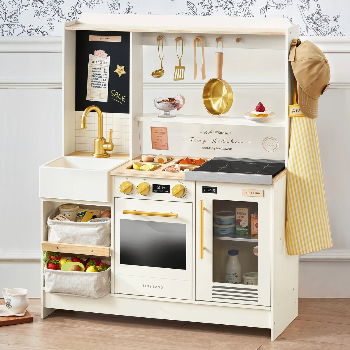 White kids play kitchen with stovetop, oven, sink, and hanging utensils