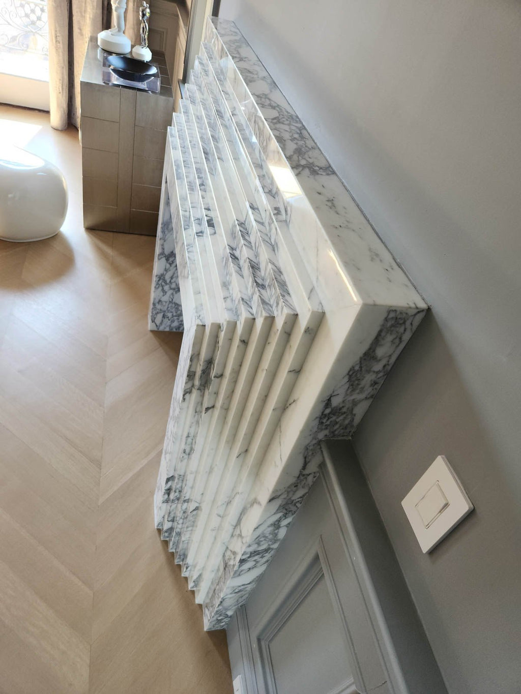 Marble fireplace ledge and fluted side paneling with black firebox insert