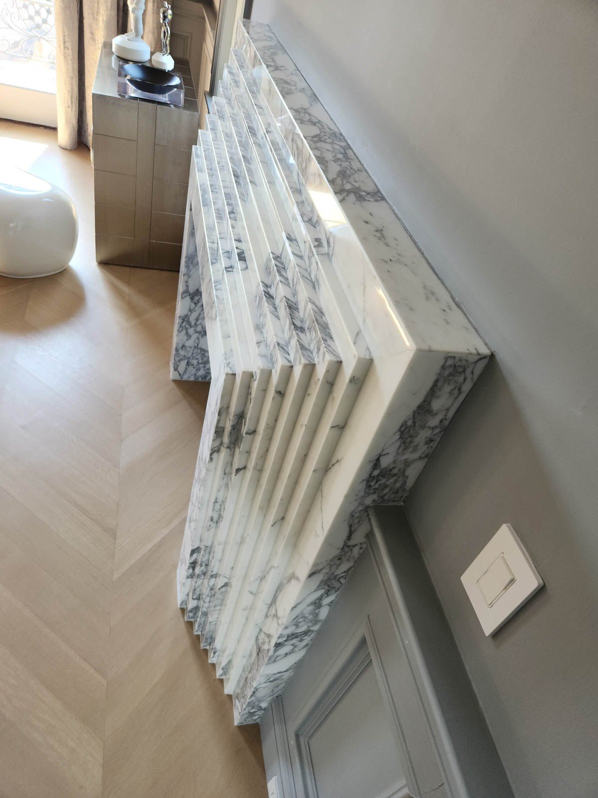 Marble fireplace ledge and fluted side paneling with black firebox insert