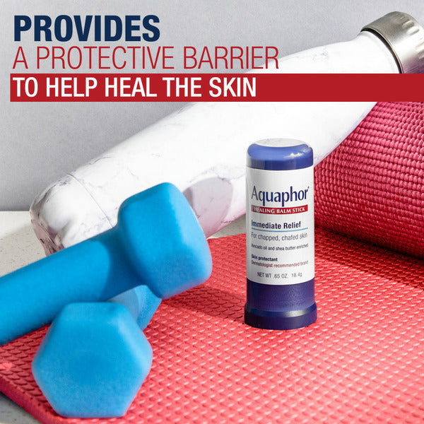 Healing balm stick on red textured surface with capped blue base