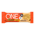 Protein bar in orange wrapper with peanut butter flavor branding