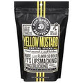 Yellow mustard pretzel sticks in black resealable bag