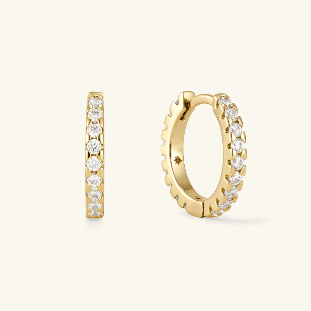 Gold hoop earrings with clear pavé stones, front and side view