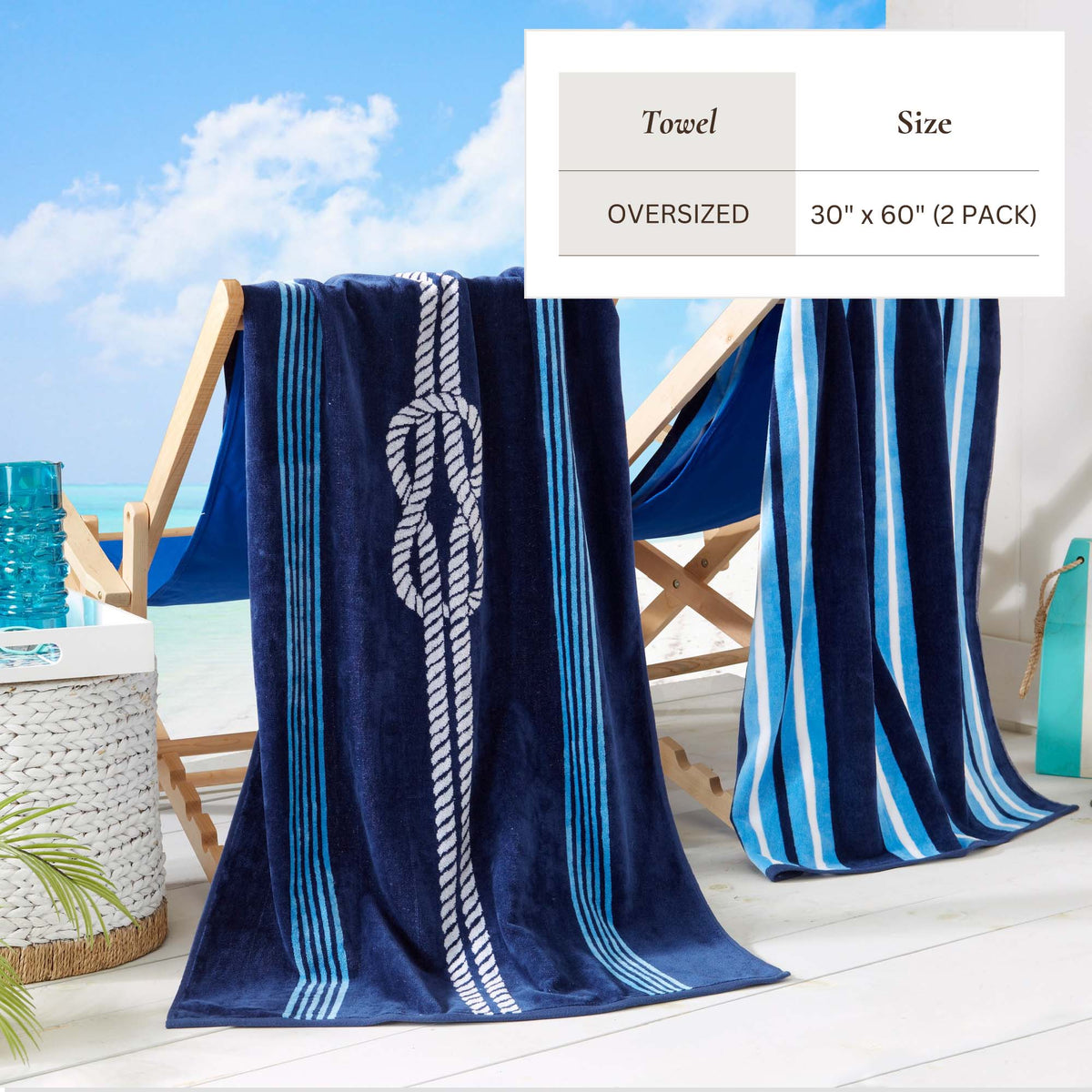Oversized blue cotton velour beach towel with light stripes and central knot motif