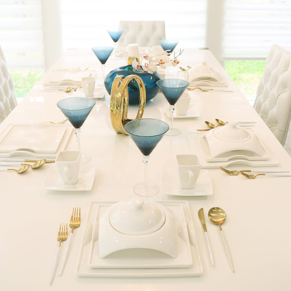 Square porcelain dinnerware set layout with plates, bowls, and cups