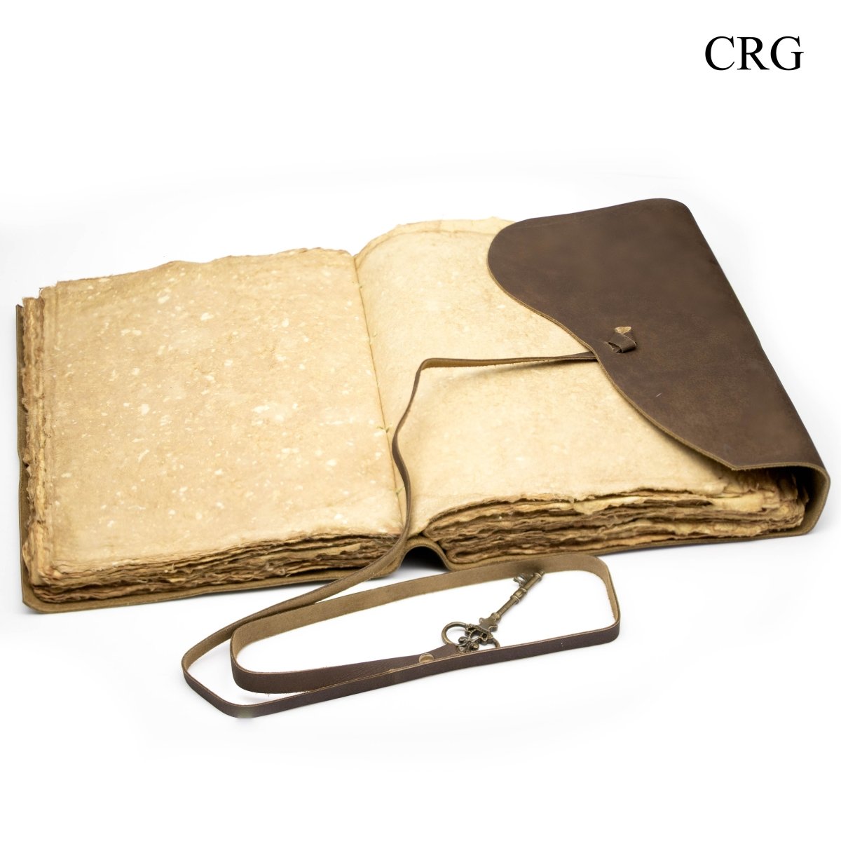 Leather journal with strap and key, open pages, tan and dark brown.