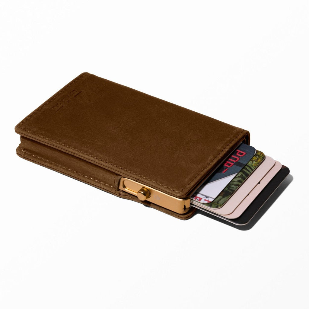 Brown bifold leather wallet with snap clasp and card slots visible