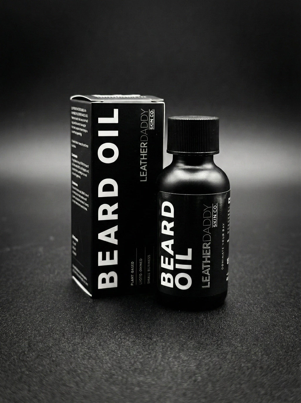Beard oil bottle and box, black packaging with LeatherDaddy Skin Co. label