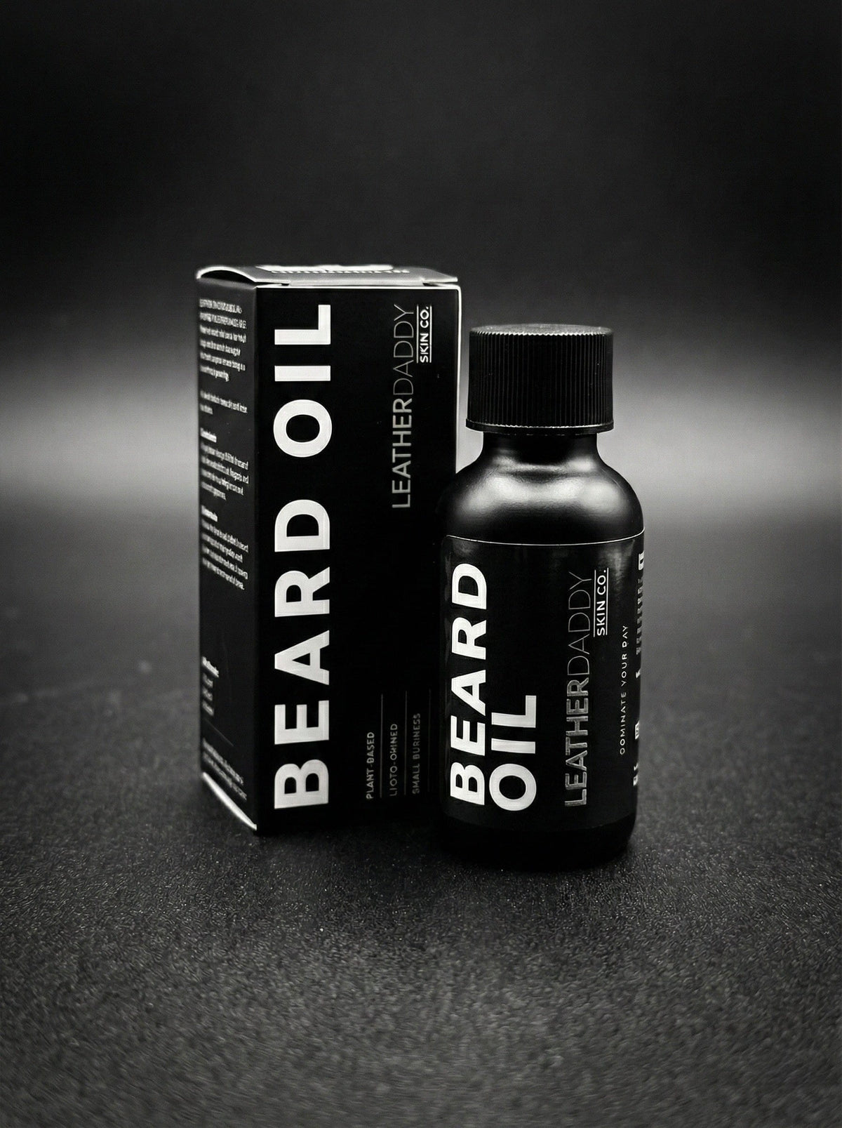 Beard oil bottle and box, black packaging with LeatherDaddy Skin Co. label