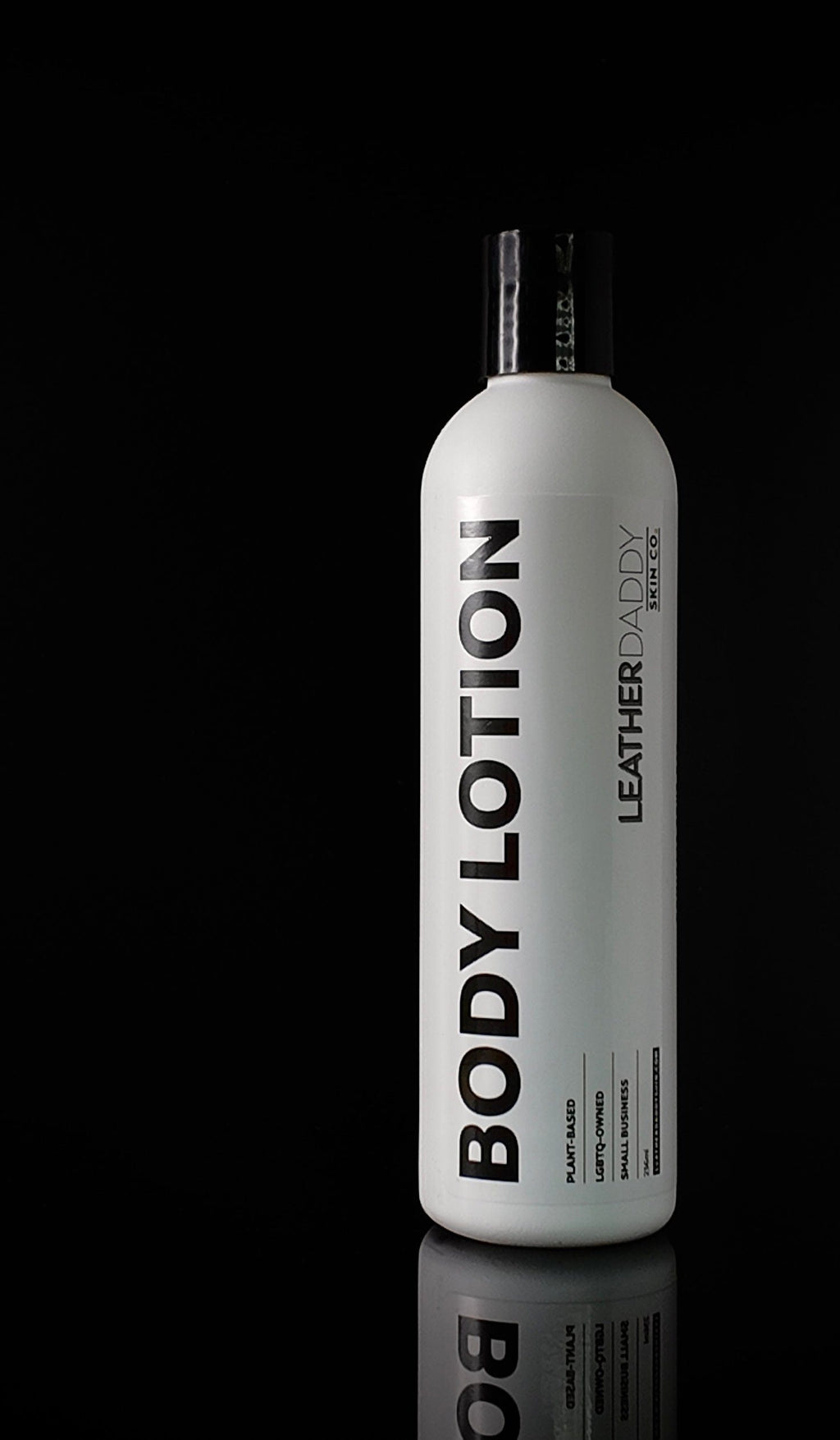 LeatherDaddy body lotion bottle, white with pump cap and vertical 'BODY LOTION' label
