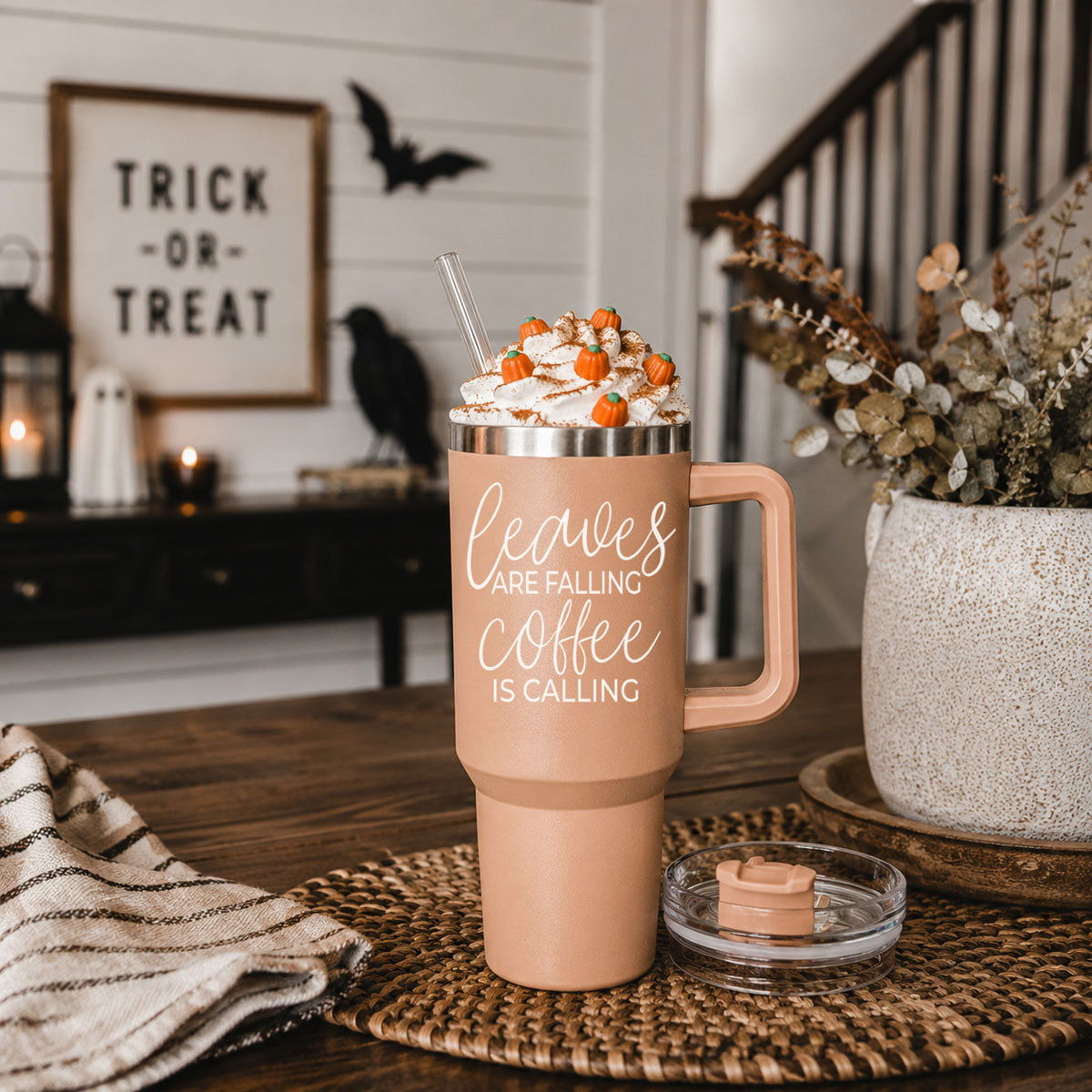 Taupe 40oz travel tumbler with clear lid and straw, rose handle, “Leaves” graphic on front