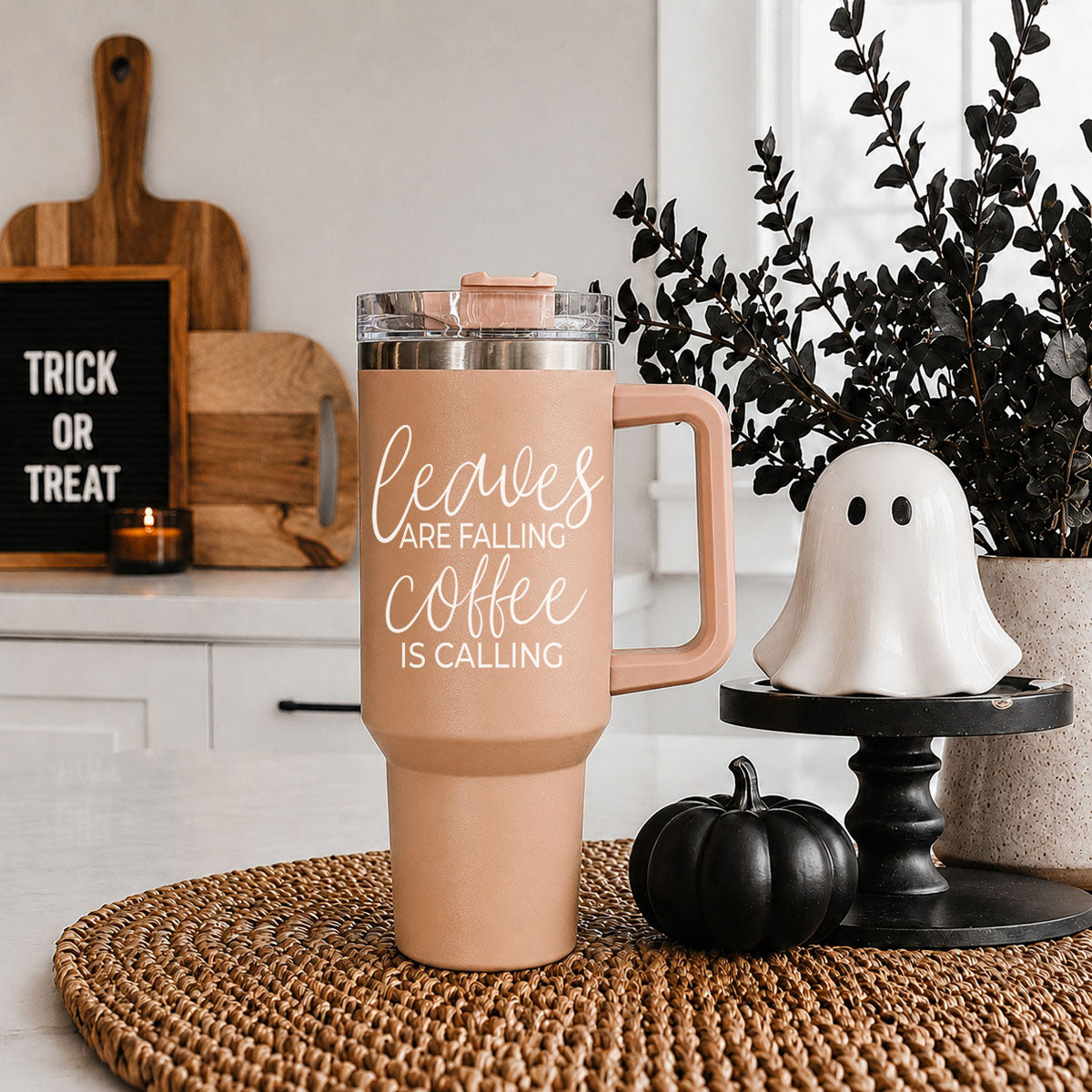 Taupe 40oz travel tumbler with clear lid and straw, rose handle, “Leaves” graphic front view